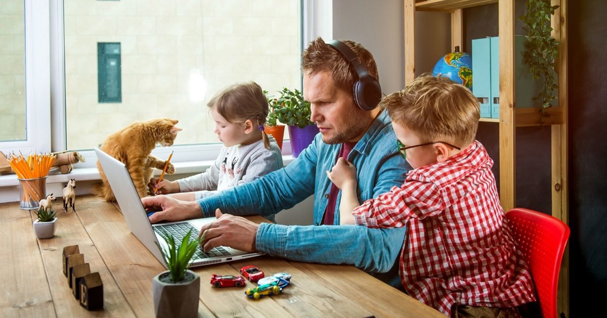 Call center agent works from home and occupies children at the same time. 